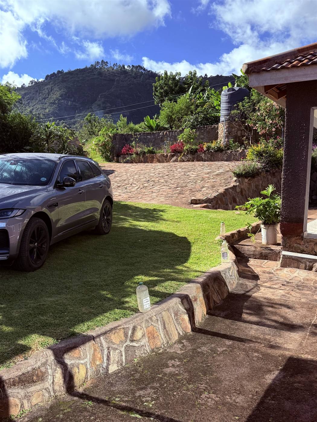 Terraced gardens, stone walls and cobbled driveway at Eland Mountain Lodge, Chimanimani